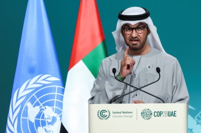COP28 President Sultan Al Jaber, of the United Arab Emirates, addresses the plenary, after a draft of a negotiation deal was released, at the COP28 United Nations Climate Change Conference in Dubai on Wednesday.