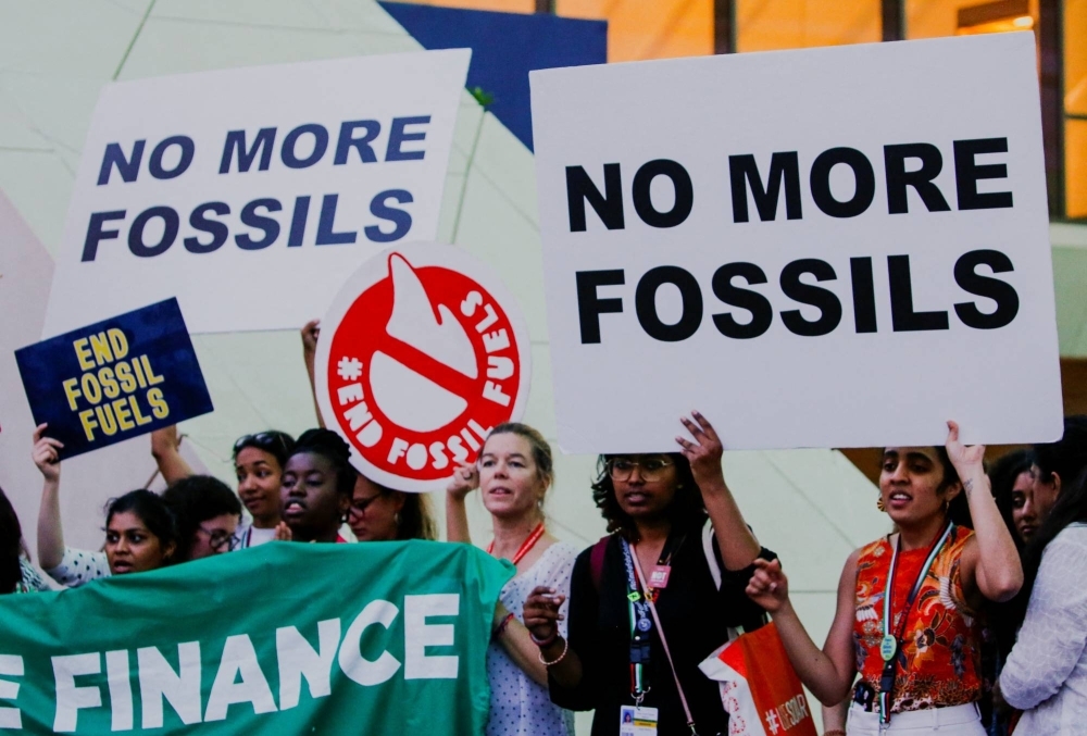 Climate activists protest against fossil fuels at Dubai's Expo City during the United Nations Climate Change Conference COP28 in Dubai on Tuesday.