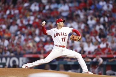 Angels pitcher Shohei Ohtani pitches against the Houston Astros in April 2022. Ohtani, who this week joined the Dodgers as a free agent, is now involved in recruiting star pitcher Yoshinobu Yamamoto. 