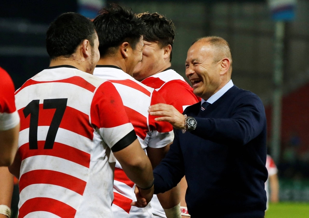 Japan head coach Eddie Jones celebrates after the team's victory over the U.S. at the 2015 Rugby World Cup. 