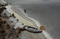 A dry area that shows the drop in the level of Lake Titicaca, Latin America's largest freshwater basin, as it is edges toward record low levels, on Cojata Island, Bolivia, in October. | REUTERS