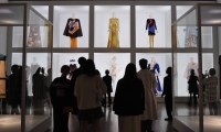 Visitors in the last gallery of “Yves Saint Laurent, Across the Style” at the National Art Center, Tokyo, view designs inspired by fine art. | Thu-Huong Ha
