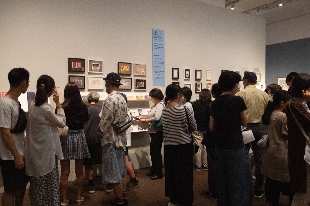 Visitors browse souvenirs at the popular gift shop for Tokyo Metropolitan Art Museum’s “Henri Matisse: The Path to Color.”