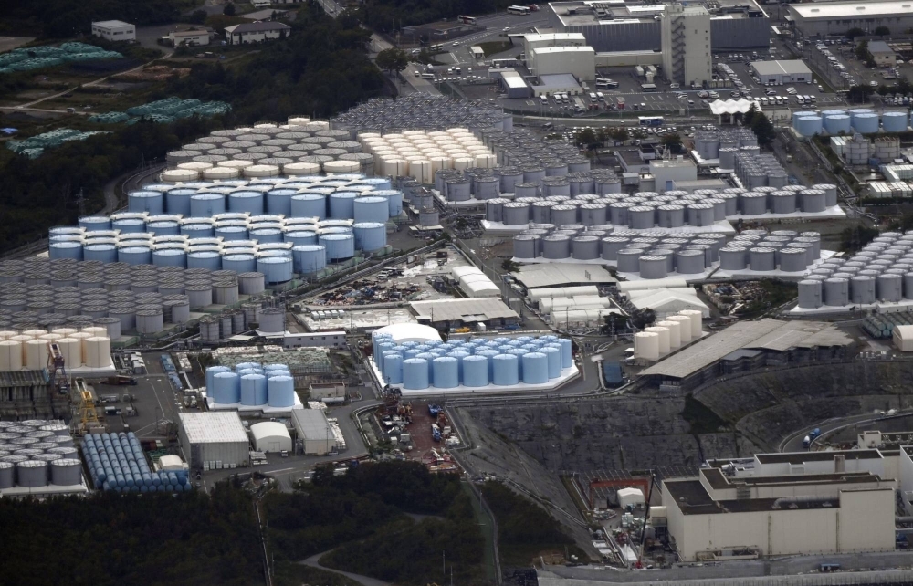 Water tanks containing treated radioactive water on the grounds of the Fukushima No. 1 nuclear power plant in October