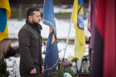 Ukrainian President Volodymyr Zelenskyy pays his respects at the graves of Ukrainian soldiers in Lviv on Friday. 