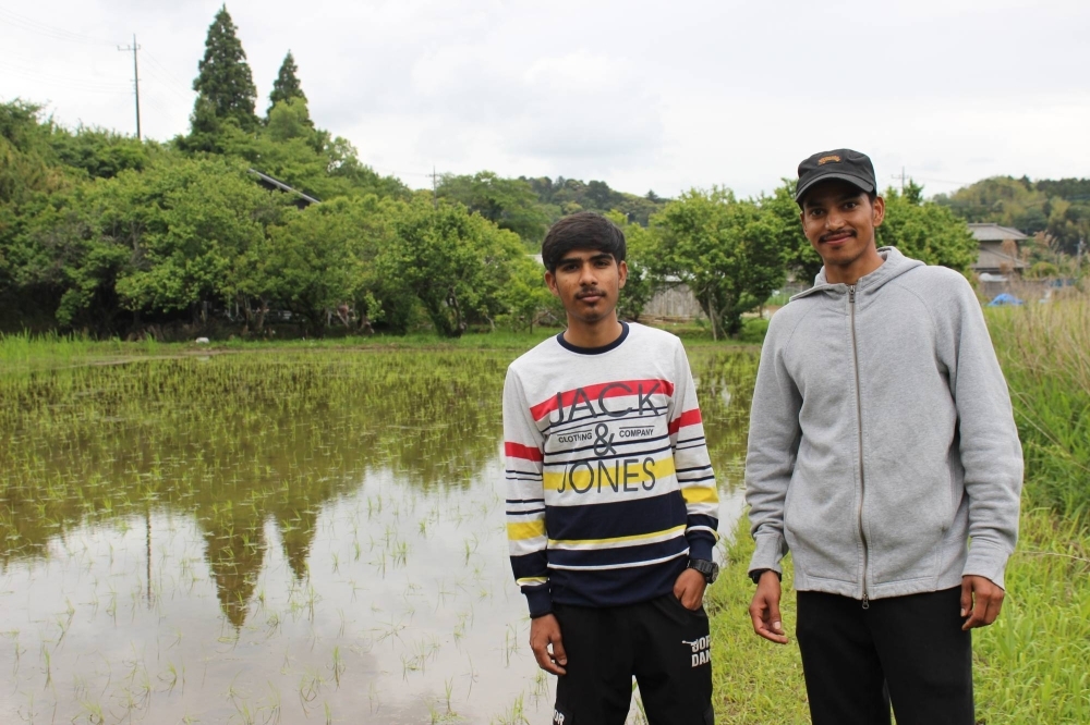 Shiv Kumar (left) and Nirmal Singh say they are learning a lot about living and thriving in Japan while taking part in the Technical Intern Trainee Program. Their case, however, seems to be an exception to the norm.