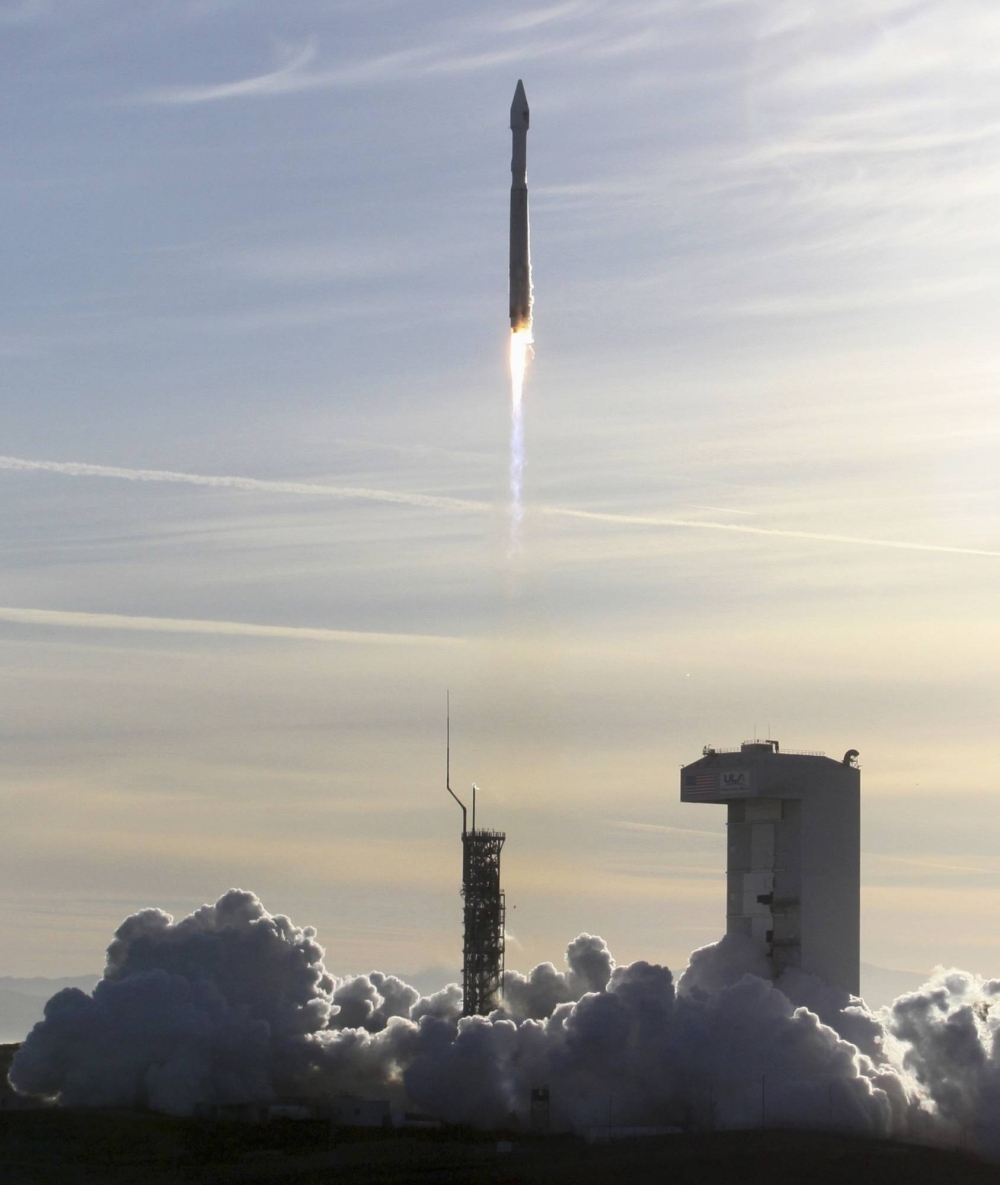 An Atlas 5 ULA rocket carrying a satellite for the Defense Meteorological Satellite Program is launched from Vandenberg Air Force Base in California.