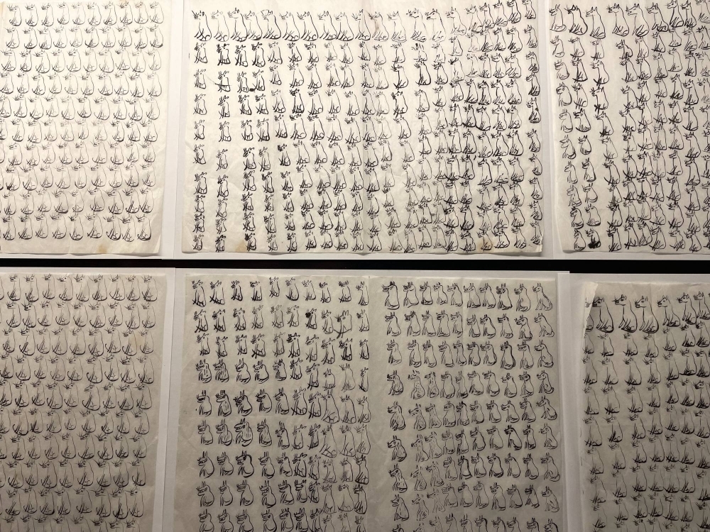 A total of 1,010 drawings of wolves fill six sheets of paper exhibited at the folk museum in Murata, Miyagi Prefecture
