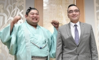 Sumo stablemaster Shikoroyama (right) with wrestler Abi in Nagoya in June 2019 | Kyodo