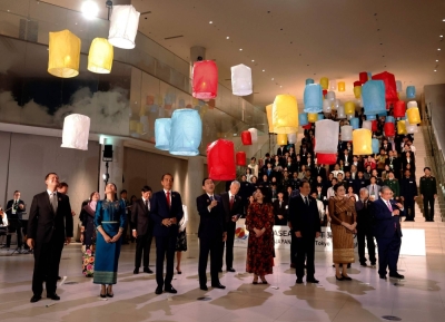 ASEAN leaders and their spouses release paper lanterns into the air with students from ASEAN member states during a lighting ceremony for the ASEAN-Japan Commemorative Summit at Azabudai Hills in Tokyo on Sunday.