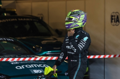 Mercedes driver Lewis Hamilton removes his helmet after the qualifying session for the Abu Dhabi Grand Prix on Nov. 25.