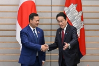 Prime Minister Fumio Kishida greets Cambodian Prime Minister Hun Manet during their bilateral meeting at the prime minister's official residence in Tokyo on Monday. | Pool / via REUTERS