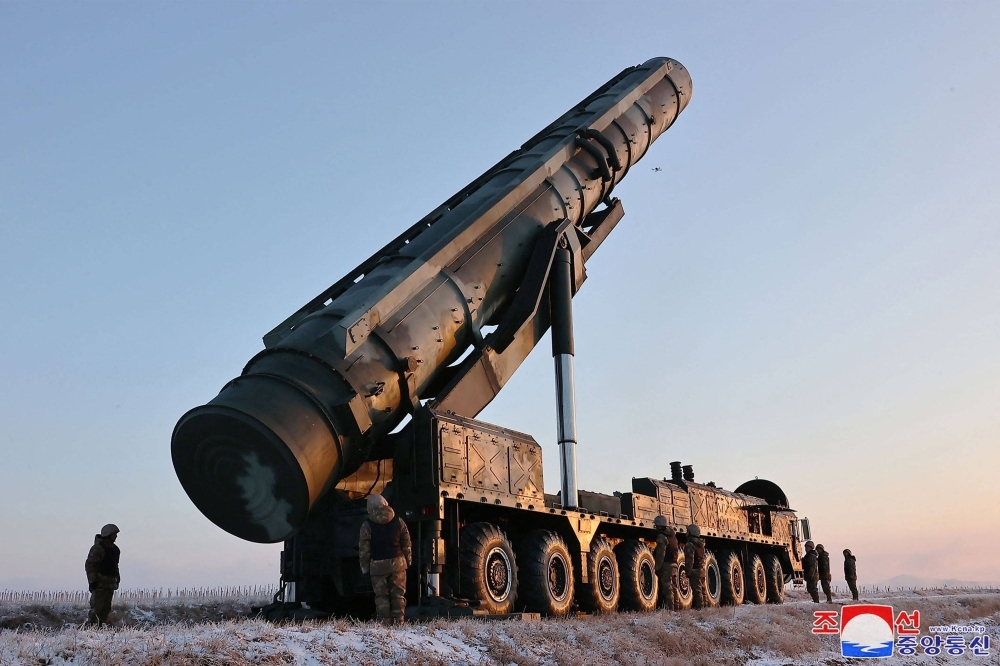A mobile missile launcher awaits the order to fire a Hwasong-18 intercontinental ballistic missile from an undisclosed location in North Korea in this undated picture released Tuesday.