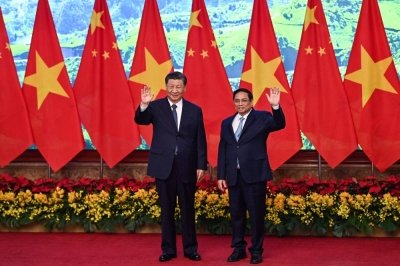 Vietnamese Prime Minister Pham Minh Chinh and Chinese leader Xi Jinping meet in Hanoi on Dec. 13.