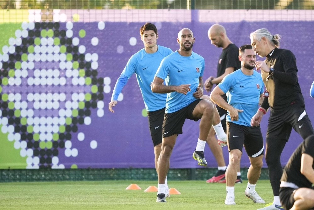 Hiroki Sakai (left) and other Urawa Reds players train ahead of Tuesday's Club World Cup game against Manchester City.
