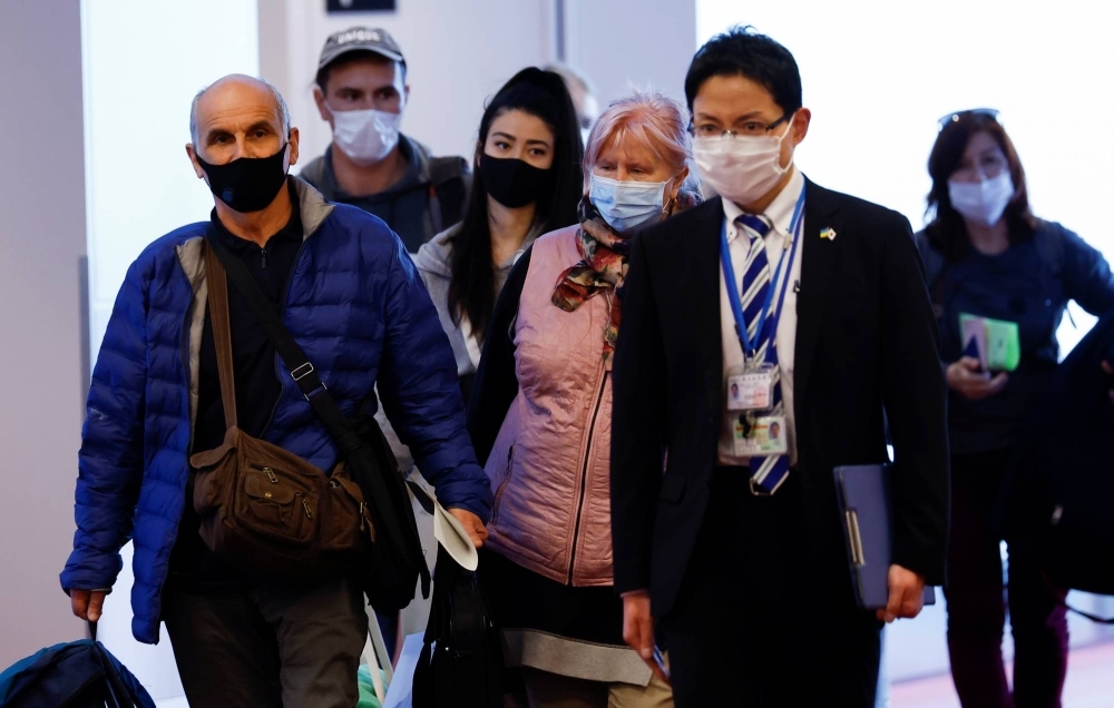 Ukrainian refugees who were flown to Japan by the Foreign Ministry arrive at Haneda Airport in Tokyo in April 2022.  