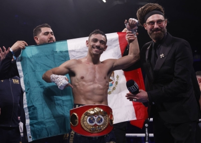 Luis Alberto Lopez celebrates after winning a fight against Josh Warrington in December 2022.
