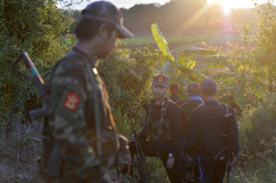 People's Liberation Army forces walk near the Sagaing Region of Myanmar on Nov. 23.