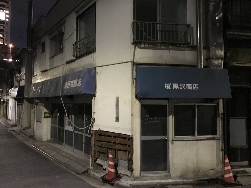There are many underpopulated residential districts across Japan, but not so many became that way due to forced closures from nearby redevelopment projects.