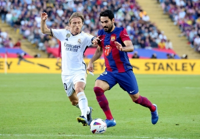 Real Madrid's Luka Modric battles for the ball with FC Barcelona's Ilkay Gundogan during a match in October. Plans for a European Super League bringing together elite soccer clubs such as the two Spanish outfits won a surprise boost on Thursday. 
