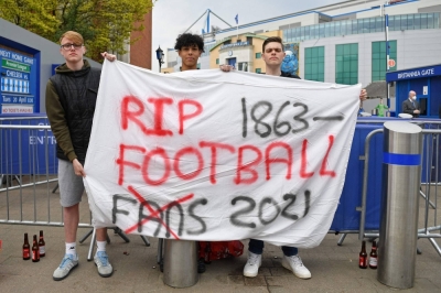Protesters against the proposal for a new European Super League outside Chelsea's Stamford Bridge Stadium in London in April 2021. 
