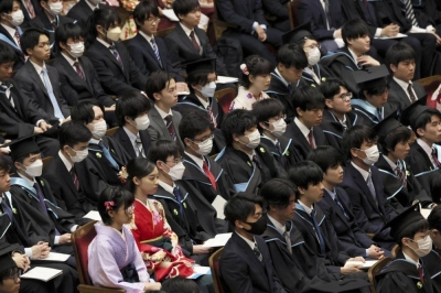 University of Tokyo students attend their graduation ceremony in the capital's Bunkyo Ward on March 24.