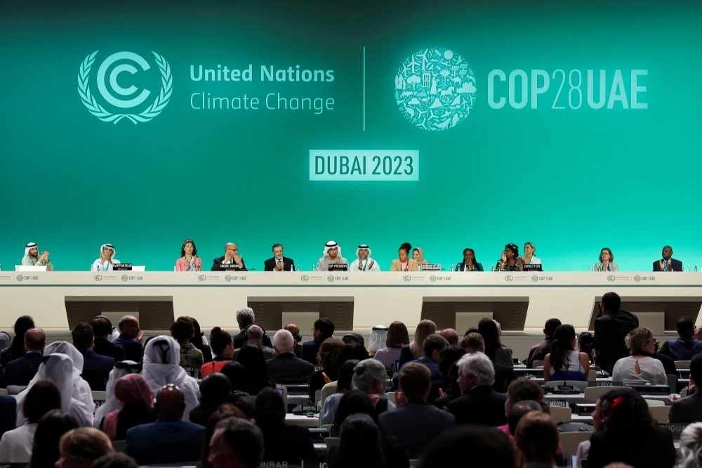 COP28 officials attend a plenary session in Dubai on Dec. 13.