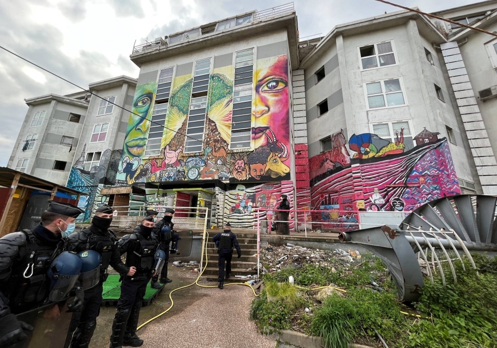 French police evict migrants from a squat in a disused industrial building not far from the Paris 2024 Olympic Village in Ile-Saint-Denis, near Paris, in April.