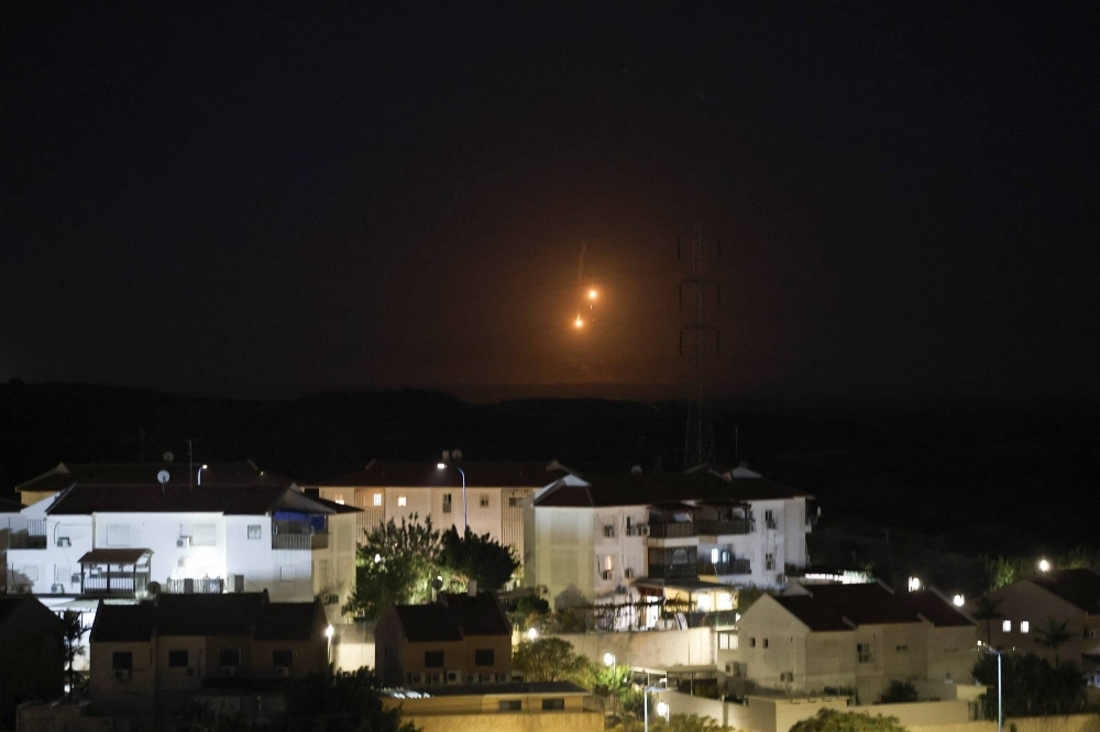 A flare falls over Gaza, amid the ongoing conflict between Israel and Hamas, on Sunday. 