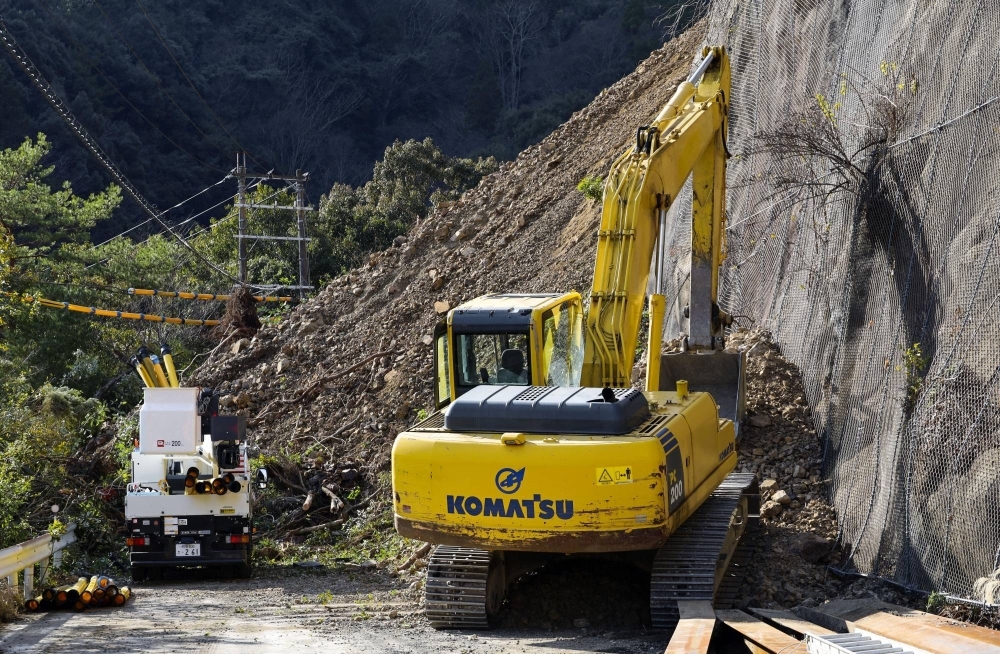 Inspections continue at the site of the landslide in Shimokitayama, Nara Prefecture, on Monday.