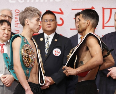 Naoya Inoue (left) faces off against Marlon Tapales after their weigh-in ahead of their four-belt world super bantamweight title unification bout at Tokyo's Ariake Arena on Tuesday.