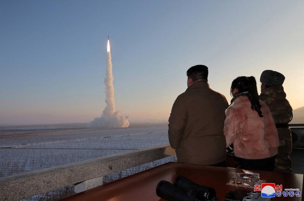 North Korean leader Kim Jong Un views the launch of a Hwasong-18 intercontinental ballistic missile, during what North Korea has described as a drill, at an unknown location on Dec.18.