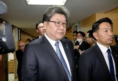 Koichi Hagiuda (left), the ruling Liberal Democratic Party’s former policy chief, has been questioned by Tokyo prosecutors over a political funds scandal.