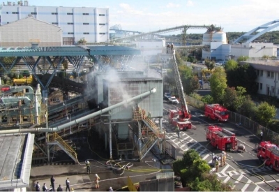 Fire fighters put out a fire at a disposal site for oversized trash in Koto Ward, Tokyo, in November.