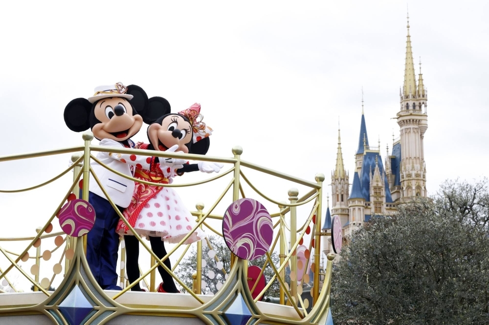 Disney characters perform on a float during a parade at Tokyo Disneyland in January.