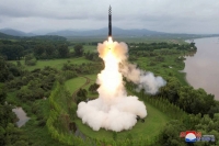 A Hwasong-18 intercontinental ballistic missile is launched from North Korea in this image released on July 13. The nation’s missile launches continued to rattle its neighbors, including South Korea and Japan, in 2023. | KCNA / VIA REUTERS
