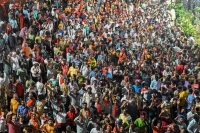 A political rally in Bengaluru, India, on April 29. Earlier this year, the South Asian nation surpassed China to become the world’s most populous country. | AFP-Jiji


