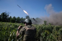 Ukrainian solider fire a missile toward enemy positions, in the Donetsk region of Ukraine on June 7. The Russia-Ukraine war is nearing its second anniversary with no end in sight. | Tyler Hicks/The New York Times