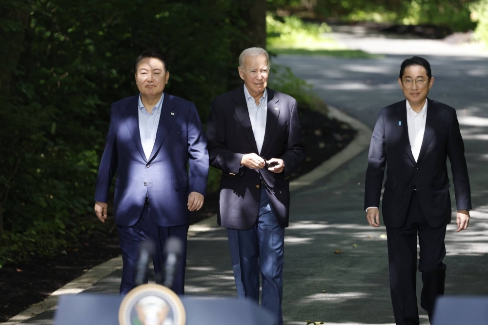 South Korean President Yoon Suk-yeol, U.S. President Joe Biden and Prime Minister Fumio Kishida arrive for a news conference during a trilateral summit at Camp David, Maryland, in the United States on Aug. 18. The three countries drew closer in 2023 amid growing concerns over North Korea and China.