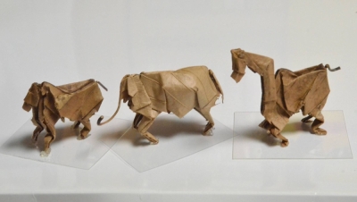 Watanabe has made shapes of (from left) a monkey, an elephant and a giraffe by folding oak leaves with his hands.