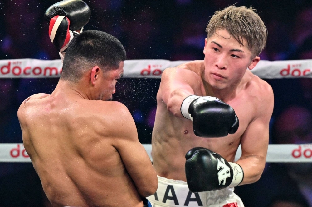 Naoya Inoue fights Marlon Tapales  during their four-belt super bantamweight title unification match at Ariake Arena in Tokyo on Tuesday. 