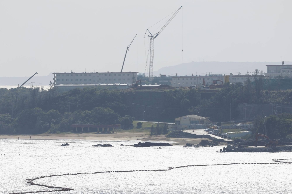 Construction work goes on in the Henoko coastal district of Nago, Okinawa Prefecture, on Monday, with Oura Bay in the foreground.