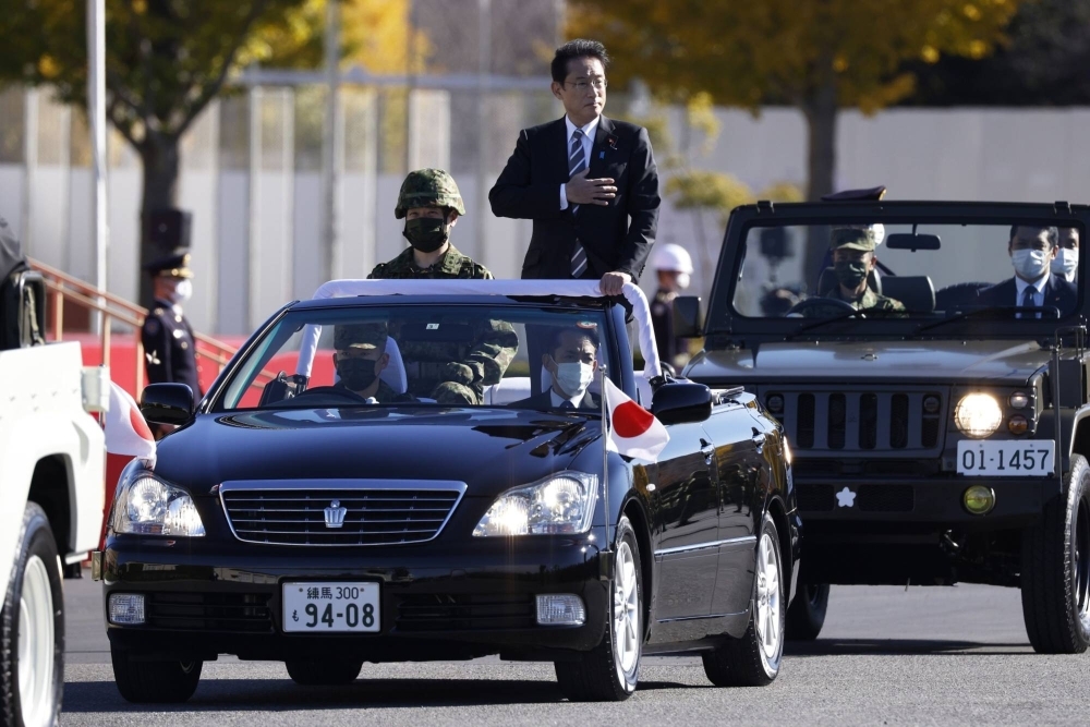 Prime minister Fumio Kishida reviews Japan Self-Defense Forces troops at Camp Asaka in Tokyo in November 2021. 
