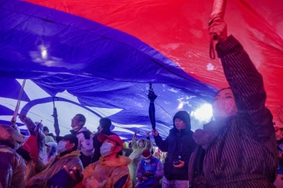 Supporters hoist a giant Taiwan national flag during a campaign rally for Kuomintang ahead of Taiwan's presidential election, in Taipei on Saturday. 
