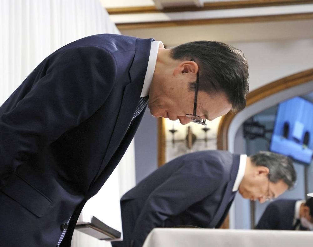 Tomihiro Tanaka, president of the Japan branch of the Unification Church, bows in apology during a news conference on Nov. 7 in Tokyo. 