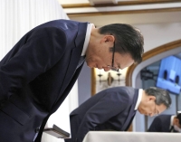 Tomihiro Tanaka, president of the Japan branch of the Unification Church, bows in apology during a news conference on Nov. 7 in Tokyo.  | Jiji