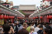 The Nakamise-dori shopping street in Tokyo’s Asakusa district. Foreign tourists returned in droves in 2023, spurring fresh concerns of overtourism. The influx of visitors came after Japan downgraded the status of COVID-19 to a lower-risk disease category, effectively ending all pandemic-related restrictions. 
 | Jiji
