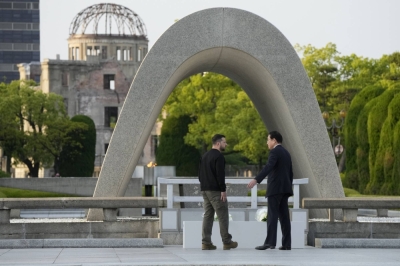 Ukrainian President Volodymyr Zelenskyy (left) and Prime Minister Fumio Kishida visit the cenotaph for atomic bomb victims in Hiroshima on May 21 during the Group of Seven summit. Zelenskyy’s visit to one of the two cities attacked with a nuclear weapon came amid Russia’s veiled threats to use its nuclear arsenal in its war against Ukraine.