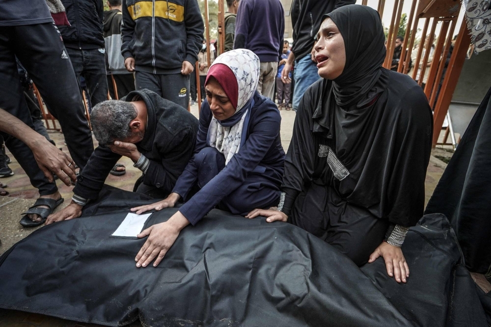 Relatives mourn a loved one killed during Israeli bombardment at Nasser Hospital in Khan Yunis on the southern Gaza Strip on Wednesday.