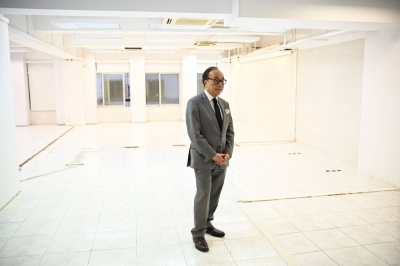 Veteran politician Alan Leong in the now-empty headquarters of the Civic Party, once the city's second largest opposition party, in Hong Kong. Six lapel pins bearing the Civic Party's founding date are all Hong Kong veteran politician Alan Leong kept when the once-prominent opposition group cleared its headquarters and shuttered its doors days before the new year.